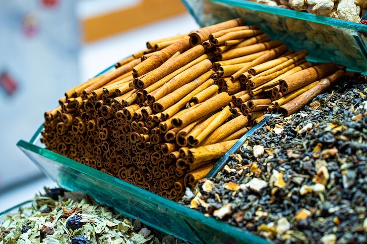 Cinnamon Sticks and Dried Herbs in a Market Display